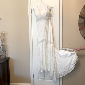 Wedding Dress. Never worn. NWT. Marked size 10, fit size 6-8. Short train.
